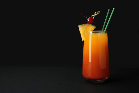 Glass of Sex on the Beach cocktail against dark backgroundの写真素材