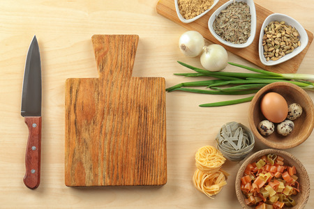 Wooden board and products on light background. Cooking master classesの写真素材