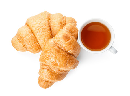 Tasty croissants and cup of tea on white backgroundの写真素材