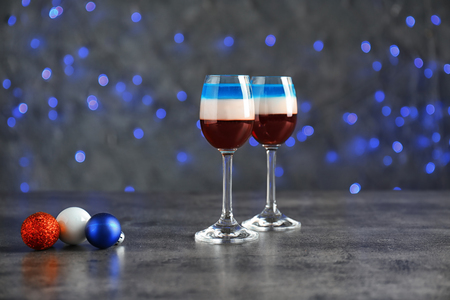 Layered cocktails in colors of American flag on tableの写真素材