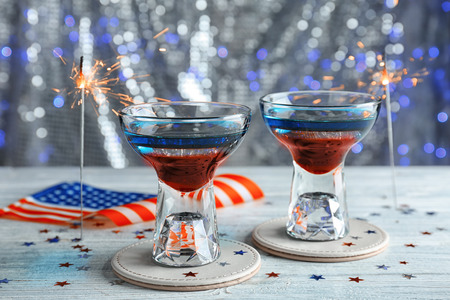 Layered cocktails in colors of American flag on tableの写真素材