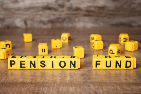 Words "Pension fund" on wooden tableの写真素材