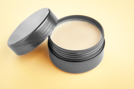 Jar with clay for hair on color backgroundの写真素材