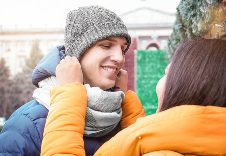 Cute couple in warm clothes outdoorsの写真素材