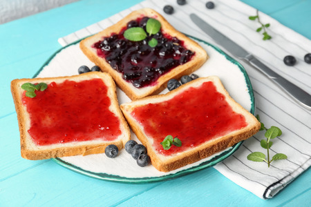 Delicious toasts with sweet jams on plateの写真素材