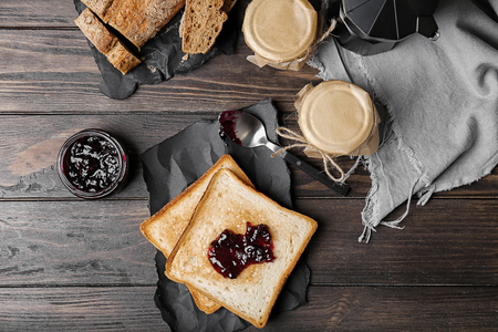 Delicious toast with sweet jam on tableの写真素材