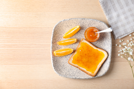 Delicious toast with sweet jam on plateの写真素材