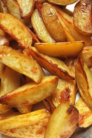 Delicious baked potato wedges, closeupの写真素材