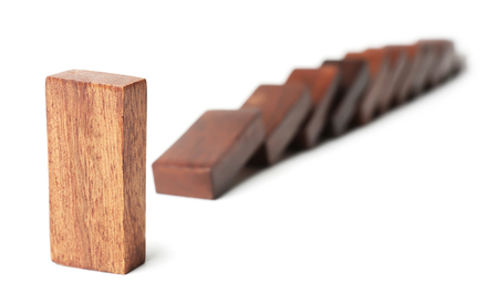 One domino standing out from others on white background. Think different conceptの写真素材