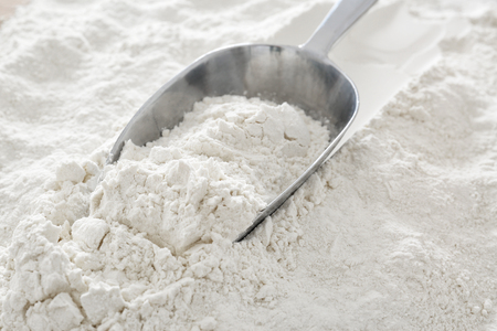 Scoop on flour, closeupの写真素材