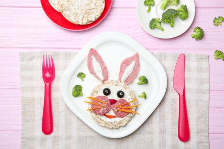 Funny food idea for kid breakfast on wooden backgroundの写真素材