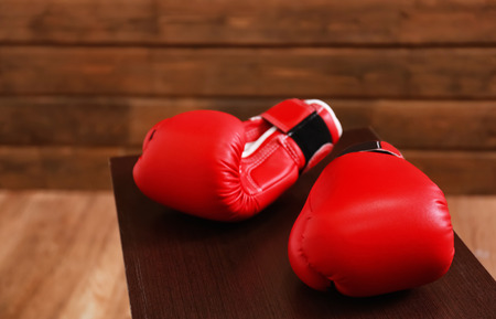 Boxing gloves on wooden benchの写真素材