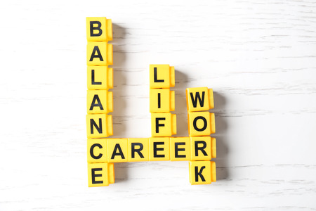 Crossword puzzle with words BALANCE, LIFE, WORK and CAREER on light backgroundの写真素材