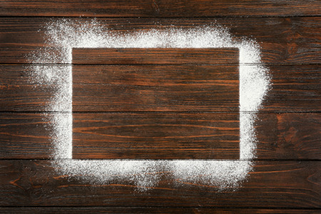 Rectangle frame made of flour on wooden background, top viewの写真素材