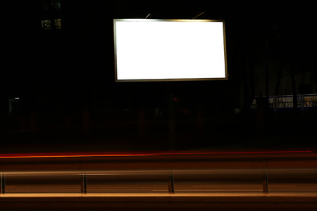 Blank advertisement board on street at nightの写真素材