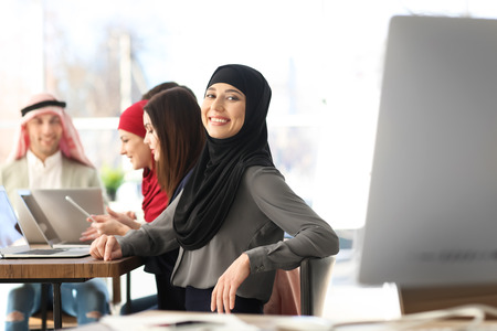 Muslim woman in traditional clothes on business meetingの写真素材