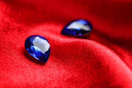 Precious stones for jewellery on red velvetの写真素材