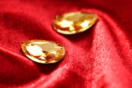Precious stones for jewellery on red velvetの写真素材