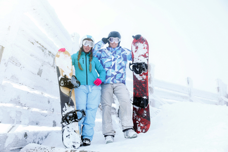 Young couple at snowy resort. Winter vacationの写真素材