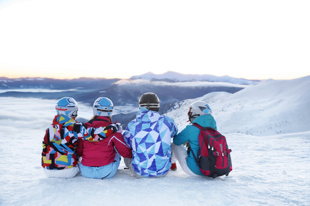 Group of friends enjoying the beauty of snowy ski resort. Winter vacationの写真素材