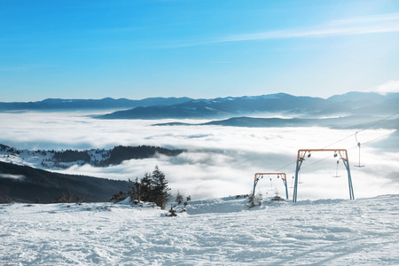 Ski lift at snowy resort in mountains. Winter vacationの写真素材