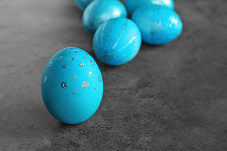 Dyed Easter eggs on grey background