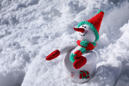 Toy snowman on sunny frosty day. Winter vacationの写真素材