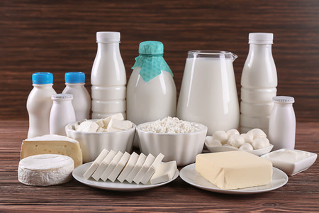 Different dairy products on wooden tableの写真素材