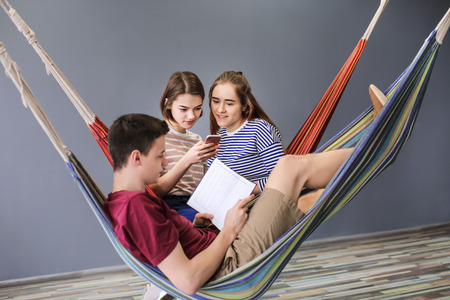 Students resting together in campus buildingの写真素材