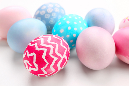 Dyed Easter eggs on white background, closeupの写真素材