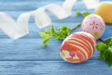 Colorful Easter eggs on wooden backgroundの写真素材