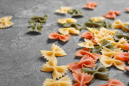 Uncooked pasta on grey background, closeupの写真素材