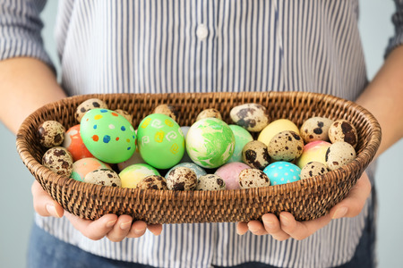 Young woman with colorful Easter eggs, closeup