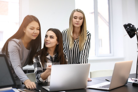 Young people having business meeting in officeの写真素材