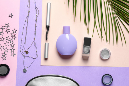 Set of decorative cosmetics and accessories on color backgroundの写真素材