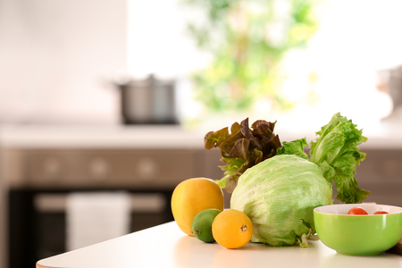 Fresh vegetables on table in kitchen. Diet food conceptの写真素材