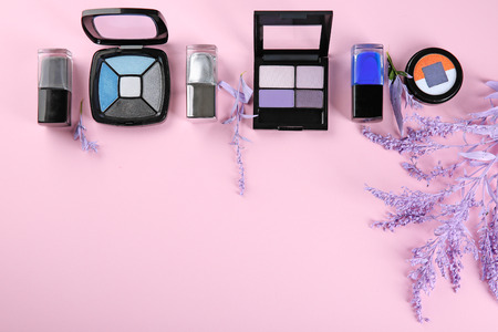 Flat lay composition with decorative cosmetics on color backgroundの写真素材