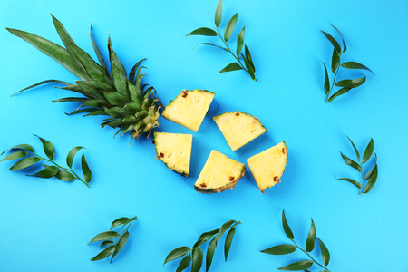 Composition with fresh pineapple slices on color backgroundの写真素材