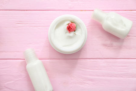 Moisturizing cosmetics on wooden table, top viewの写真素材
