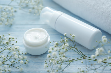 Cosmetics with herbal extract on white wooden backgroundの写真素材