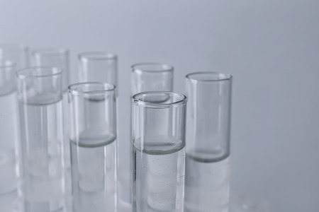 Test tubes with water on light background