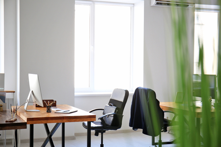 Office interior with tables and armchairs. Workplace designの写真素材