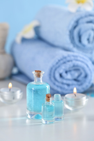 Bottles of essential oil for spa procedures on tableの写真素材