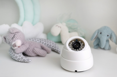 Baby monitor and toys on tableの写真素材