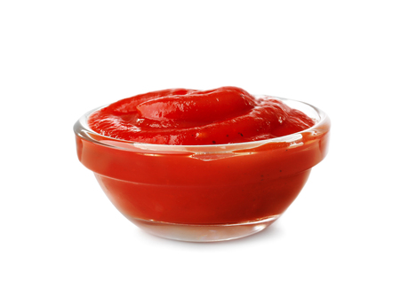 Tasty tomato sauce in glass bowl on white backgroundの写真素材