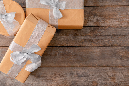 Different gift boxes on wooden background, top viewの写真素材