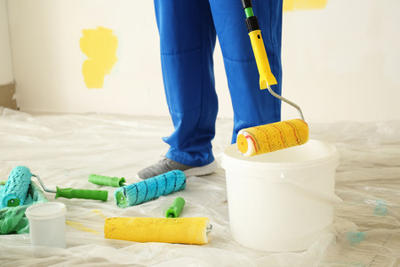 Male painter in uniform working indoorsの写真素材