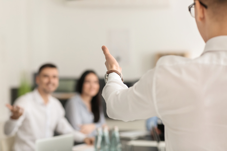 Young man holding business meeting in officeの写真素材