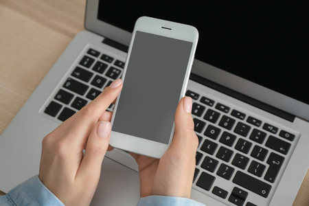 Young woman using mobile phone for online food delivery