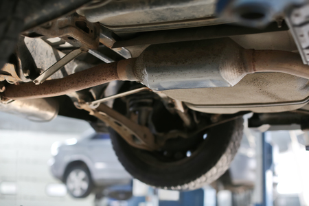 Car on lift at service center, closeupの写真素材